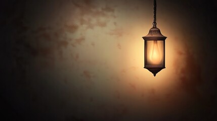 Glowing lantern hanging against textured wall