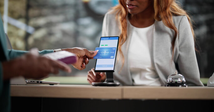 Young African American woman making contactless payment