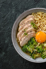 asian noodles with chicken, egg and broccoli 