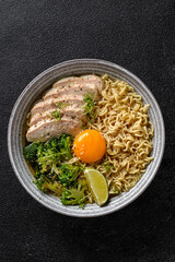 asian noodles with chicken, egg and broccoli 
