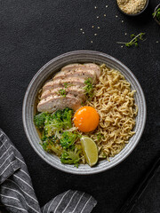 asian noodles with chicken, egg and broccoli 