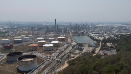 Aerial view of oil tanks at oil refinery. Gas and oil steel storage containers. Oil refinery industry at sunset - factory - petrochemical plant