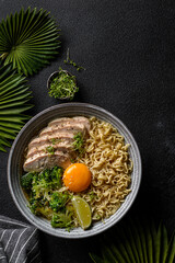 asian noodles with chicken, egg and broccoli 