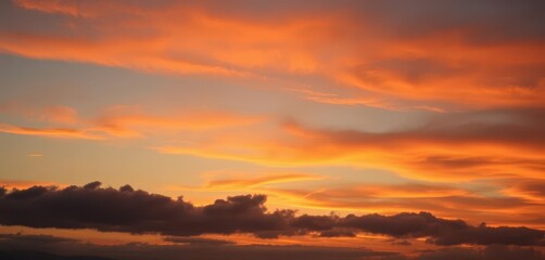 Obraz premium Dusk sky, vibrant orange-gray clouds, soft light, warm hues, cozy feeling, clouds, tranquil