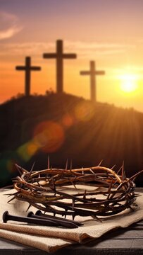 Crown of thorns and nails with three crosses at sunset
