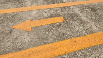 yellow arrow on asphalt