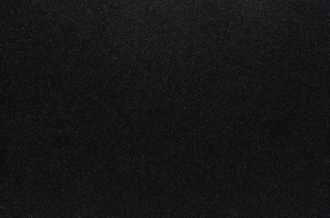 Black glitter paper texture, sparkling shiny background 