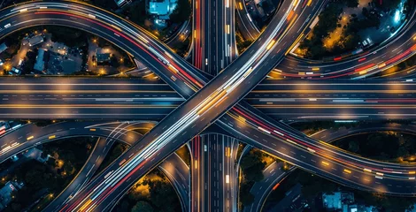  Complex highway interchange with colorful light trails, futuristic design style, night urban background, concept of modern transport infrastructure. Ai generative © VideoFlow
