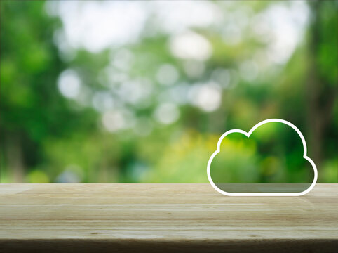  Cloud computing icon with copy space on wooden table over blur green tree in park, Technology cloud computing concept