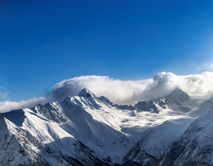 Naklejka premium A winter sky above snowy mountain peaks with clouds swirling gently beneath bright sunlight casting long shadows.