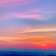 Obraz premium Serene Sunset Over Layered Blue Mountains