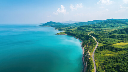 Obraz premium Aerial View of a Coastal Road Alongside Turquoise Waters