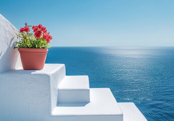 A pot of blooming pink bougainvillea in an orange terracotta pot, placed on white steps, with a sea and blue sky background