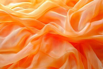 Obraz premium Orange chiffon fabric background with soft folds and delicate texture for elegant designs