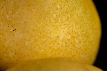 delicious yellow pears with red sides covered with water