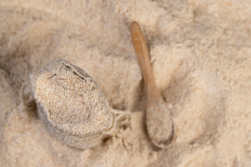 natural wholemeal wheat flour with bran in a linen bag
