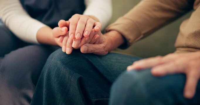 Support, senior patient and caregiver with holding hands for wellness, trust and empathy for illness. Closeup, old person and nurse with kindness, elderly care and console on sofa in retirement home