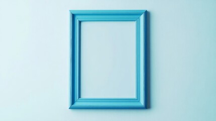 Ornate turquoise picture frame with empty center on light wall background