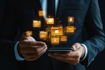 Businessperson interacts with digital email and file management icons projected onto mobile device