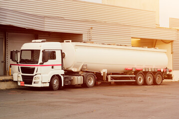 Fuel Road Tanker Truck Unloading Next To Warehouse Oil Refinary Facilities