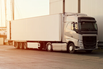 White Modern Sustainable TIR Truck At Warehouse Facilities, Supply-Chain Transportation Solutions