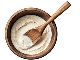 Wooden spatula in mixing bowl with dough