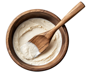 Wooden spatula in mixing bowl with dough