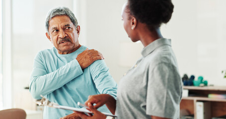 Physiotherapist, woman and senior man with shoulder pain, checklist and questions at clinic....