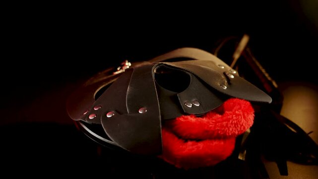 Rotating BDSM cat mask on black background showcases intricate design and craftsmanship