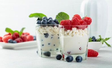 Homemade curd cheese served with fresh blueberries and raspberries.