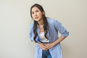 Flatulence asian young woman intolerance hand in stomach ache, suffer from food poisoning,...
