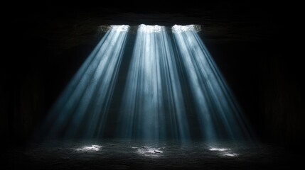 Sunlight beams through a dark cave