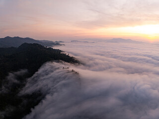 Obraz premium Aerial view Beautiful natural landscape Rainforest mountains in the sunrise or sunset time,Natural scenery tropical forest and fog in asia,Wide angle view drone shot