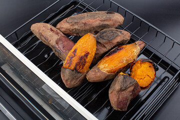 Roasted Sweet Potato isolated (yaki imo) on black background