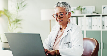 Laptop, woman and doctor in office, research for diagnosis and test results with treatment. Mature...