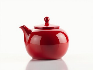 A shiny red teapot with a round body and a lid, reflecting light on a white background