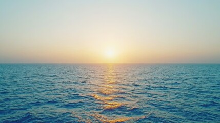 Obraz premium Serene sunset over tranquil ocean waters coastal location nature photography calm environment wide-angle viewpoint