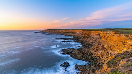 Sunset over cliffs coastal landscape high-resolution photography natural environment serene viewpoint