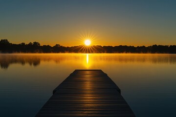 Fototapeta premium A wooden dock stretches into a calm lake at sunrise with a golden sky and distant trees view point transparent background