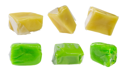 Six pieces of coconut candy, wrapped in a thin, translucent material (likely rice paper), are isolated on a white background. The candy has two flavors, original (yellow) and pandan (green).