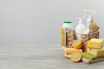 Obraz premium Eco-friendly cleaning products and supplies on wooden table, space for text