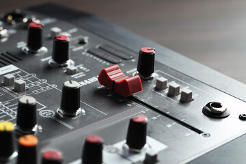 Professional mixing console on table, closeup. Radio studio equipment
