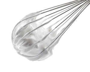 Whisk with delicious cream isolated on white
