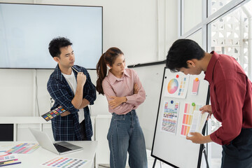 Creative Discussion on Color Choices. Team evaluating color options during a design meeting.