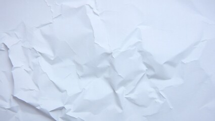 Obraz premium Crumpled paper background with wrinkled texture and a crushed paper ball