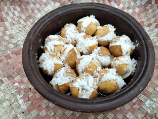 Traditional Sri Lankan salt lime pickle naturally drying under sunlight, preserving its tangy...