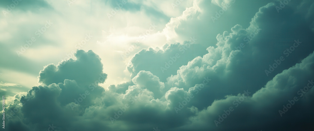 Wall mural the sky is filled with clouds and the sun is shining through them