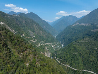 Fototapeta premium Aerial view of beautiful tropical forest mountain landscape in the Yalu Zangbu River valley area, Tibet,China