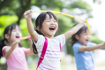 Children joyfully play outdoors, laughing with hula hoops in a park