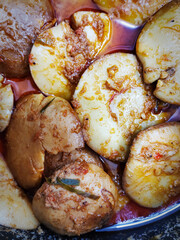 A traditional Indonesian dish called Jengkol or dogfruit cooked with rendang spices. Regional cuisine in Indonesia.